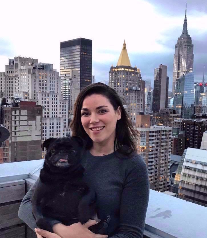 Australian woman with pet dog in Manhattan NYC near Empire State Building